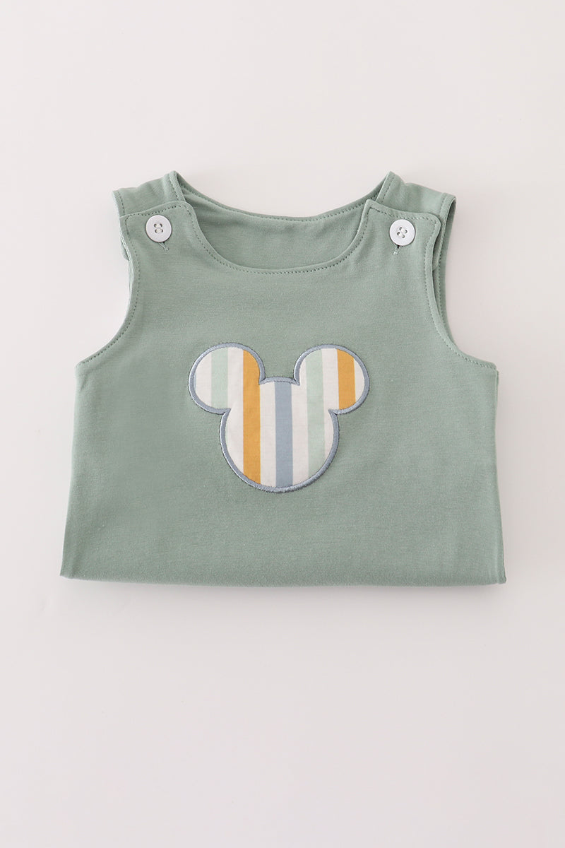 Green character applique bubble